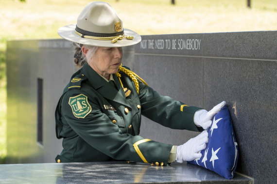 2026 Fallen Fire Fighters Memorial flag placed on Fire Fighters memorial wall