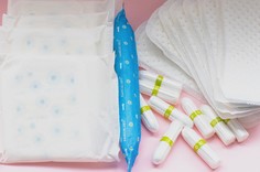 menstrual products on pink background