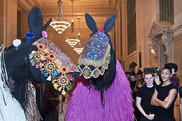 Artists dressed in horse inspired sound suits by artist Nick Cave