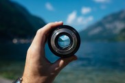 Image of hand holding a lens