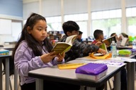 Girl reading in class