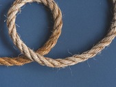 Looping rope on plain background