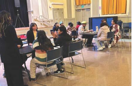 Student in a classroom with educators