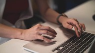 Person typing on a laptop