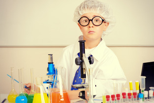 a kid with science beakers