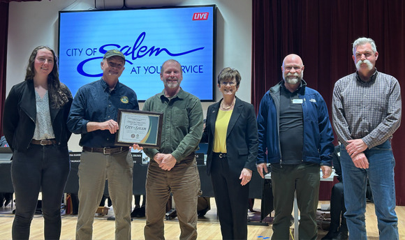 Scott Altenhoff who manages ODF’s Urban and Community Forestry Program, presents the Salem City Council the 2026 Tree City of the Year Award