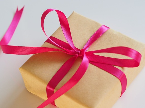 gift wrapped in brown paper and red ribbon