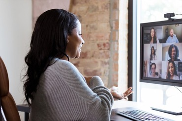 woman in front of computer during online meeting