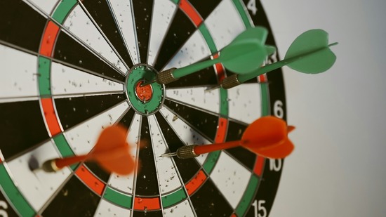 Dart board with four darts