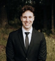 smiling white man wearing a suit