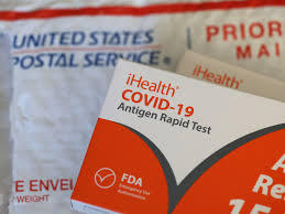photo of iHealth COVID-19 tests and US. postal service bubble mailers