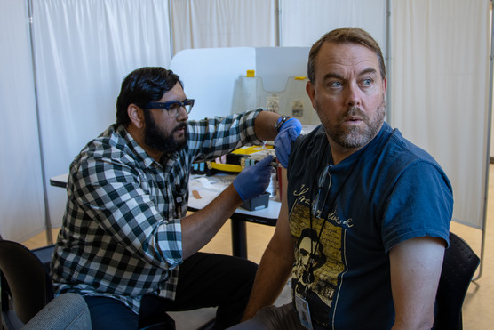 photo of OHA intermin director Dave Baden getting vaccinated