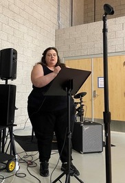 Cass singing at OSH open mic event