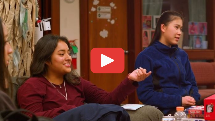 video screen shot of teenagers meeting