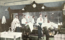 Historical postcard image o f barbers in barber shop at Hot Lake Sanatorium