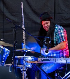 photo of a man playing the drums