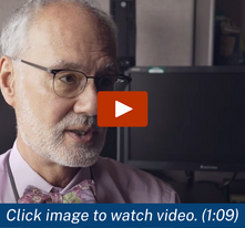 video screen shot of a man with a bow tie