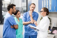 small photo - medical staff talking in group