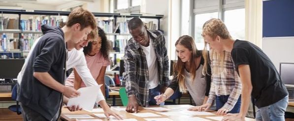 Students working at table - large