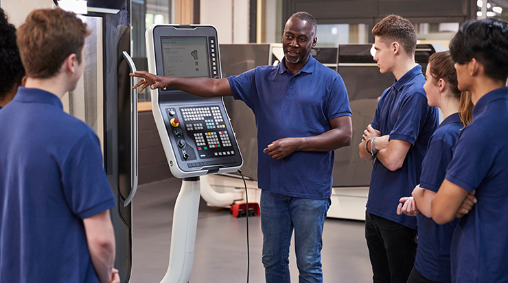 Photo of tech instructor and students