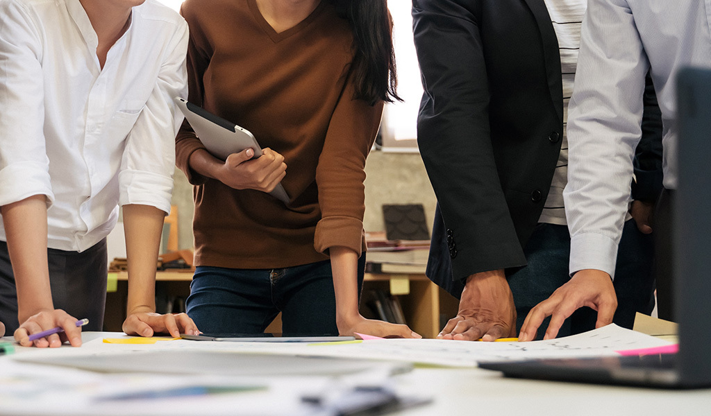 A group gives feedback on architect designs