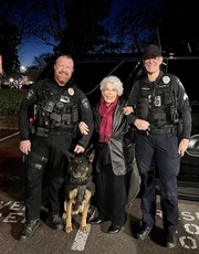 Hillsboro resident standing in the middle between a Sergeant and K-9 Officer and K-9 Rocket.