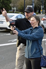 Community member running radar next to an officer.