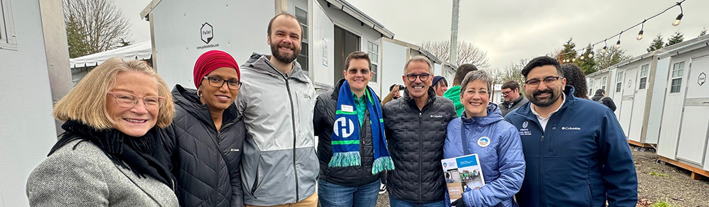 Community leaders, Hillsboro City Councilors, and partners pose at the Safe Rest Pods Reopening
