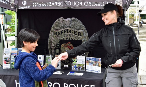 Saturday Market Handing Out Stickers