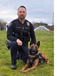 K-9 Rayo and Officer Schmidt Kneeling