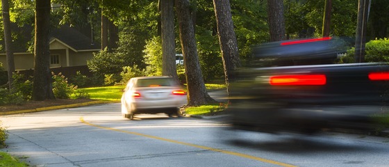 Two Vehicles Speeding Through a Neighborhood