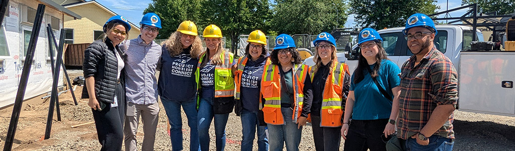 City of Hillsboro, Washington County, and Project Homeless Connect staff pose at the year-round shelter construction site