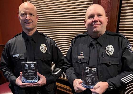 Two Volunteer Reserve Officers Holding Their Awards
