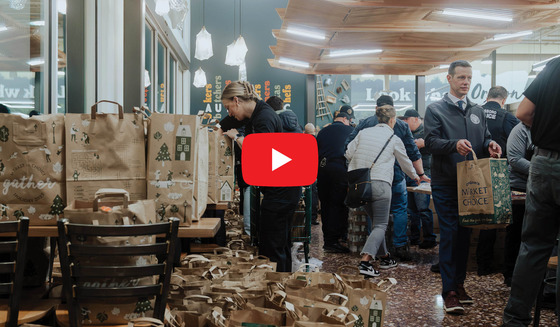 Video of Officers and School District staff packing bags of food