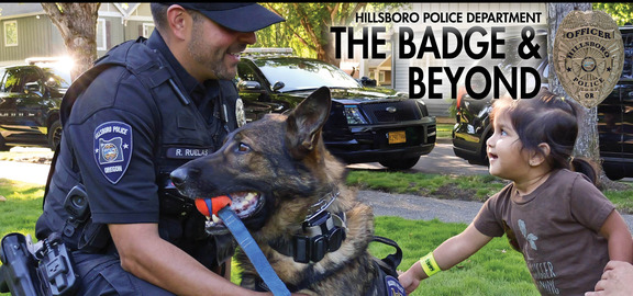 Young Girl Petting a Police K-9 and Looking at the Officer