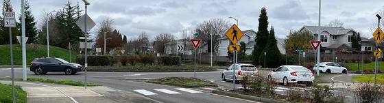 Vehicles driving through a roundabout