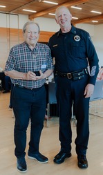 Posed photo of the Volunteer of the Year and Police Chief Jim Coleman
