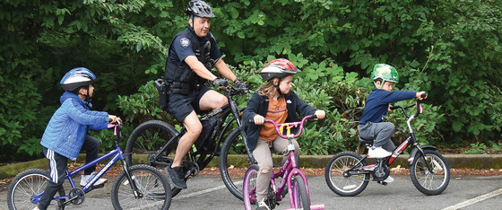 Kids Riding Their Bikes with a Hillsboro Police Officer