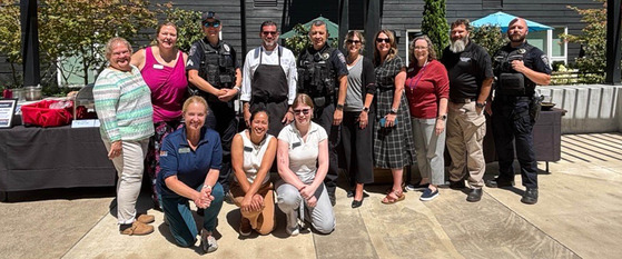 Posed Group Photo of The Ackerly Staff and Hillsboro Police Personnel