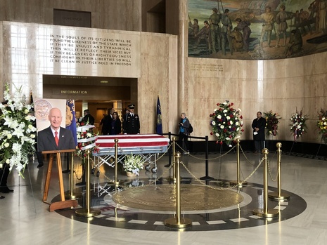 Secretary Richardson's casket and flowers in the Capitol Rotunda for the state funeral.
