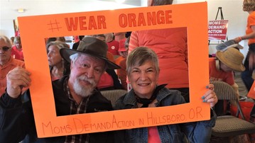 Senator Riley and Katie Riley pose for a framed photo dressed in their Orange to support ending gun violence.