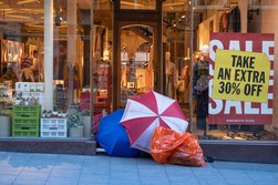 Red, white and blue umbrellas in front of store