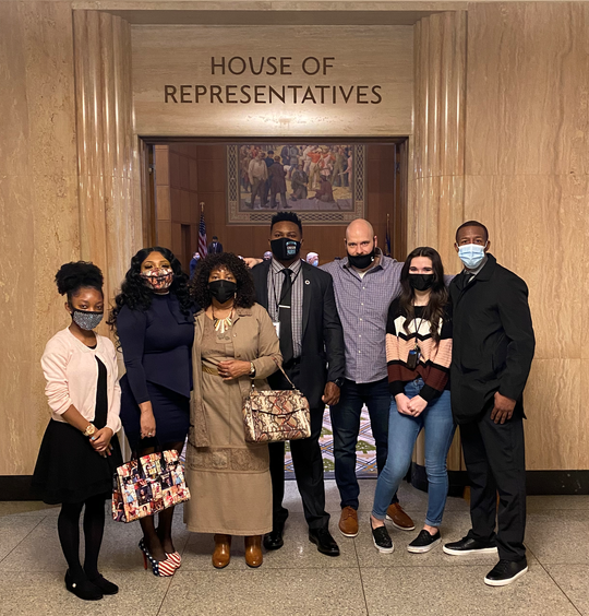 Rep Nelson with his family in from of the House of Representatives