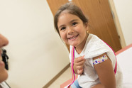 smiling girl who got immunized