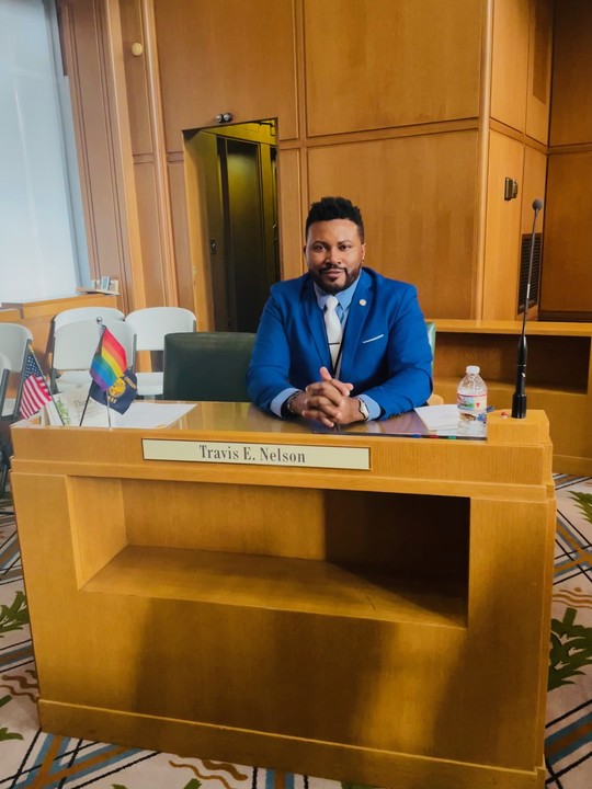 Rep Nelson sitting at his floor desk