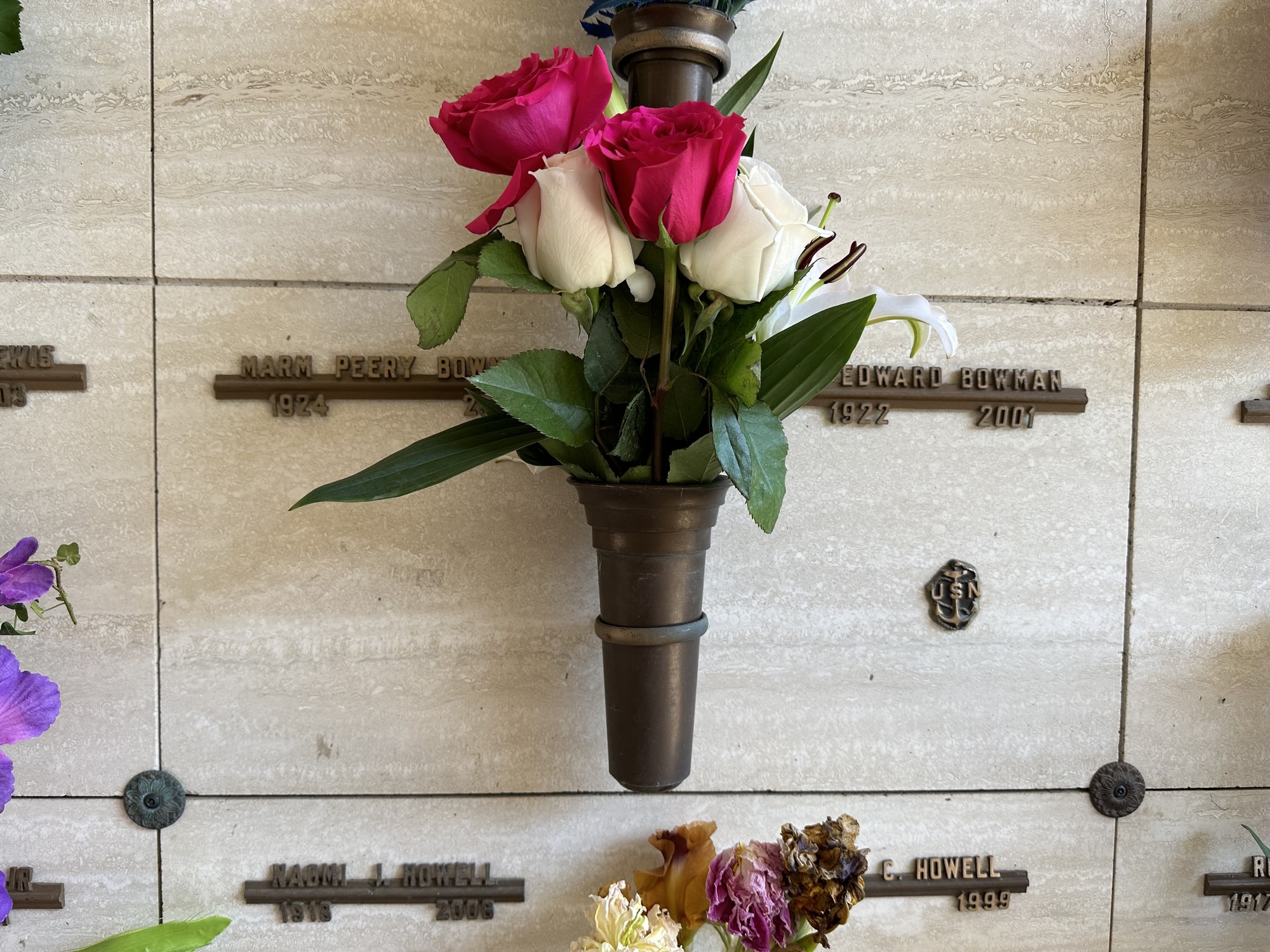 My grandmother and grandfather’s burial plots with a fresh bouquet of flowers