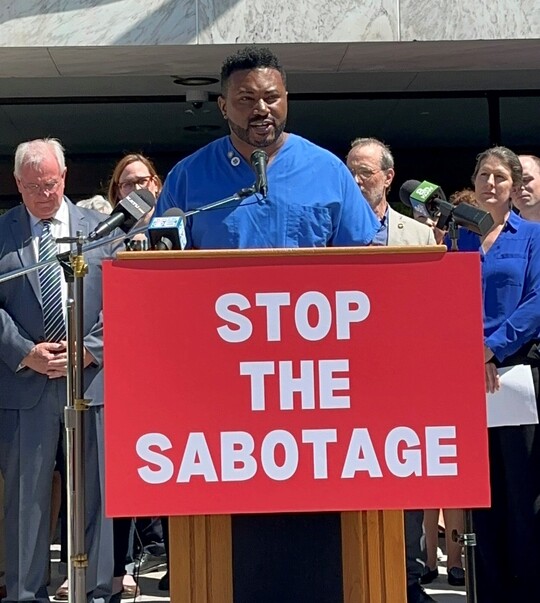 Photo of Rep Nelson speaking at the press conference