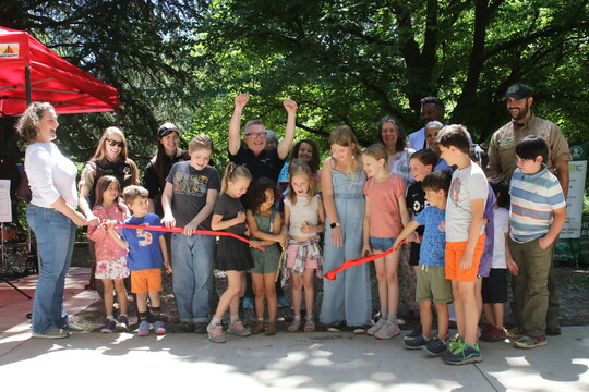 Group of kids with Commissioner Ryan and Rep nelson for the ribbon cutting