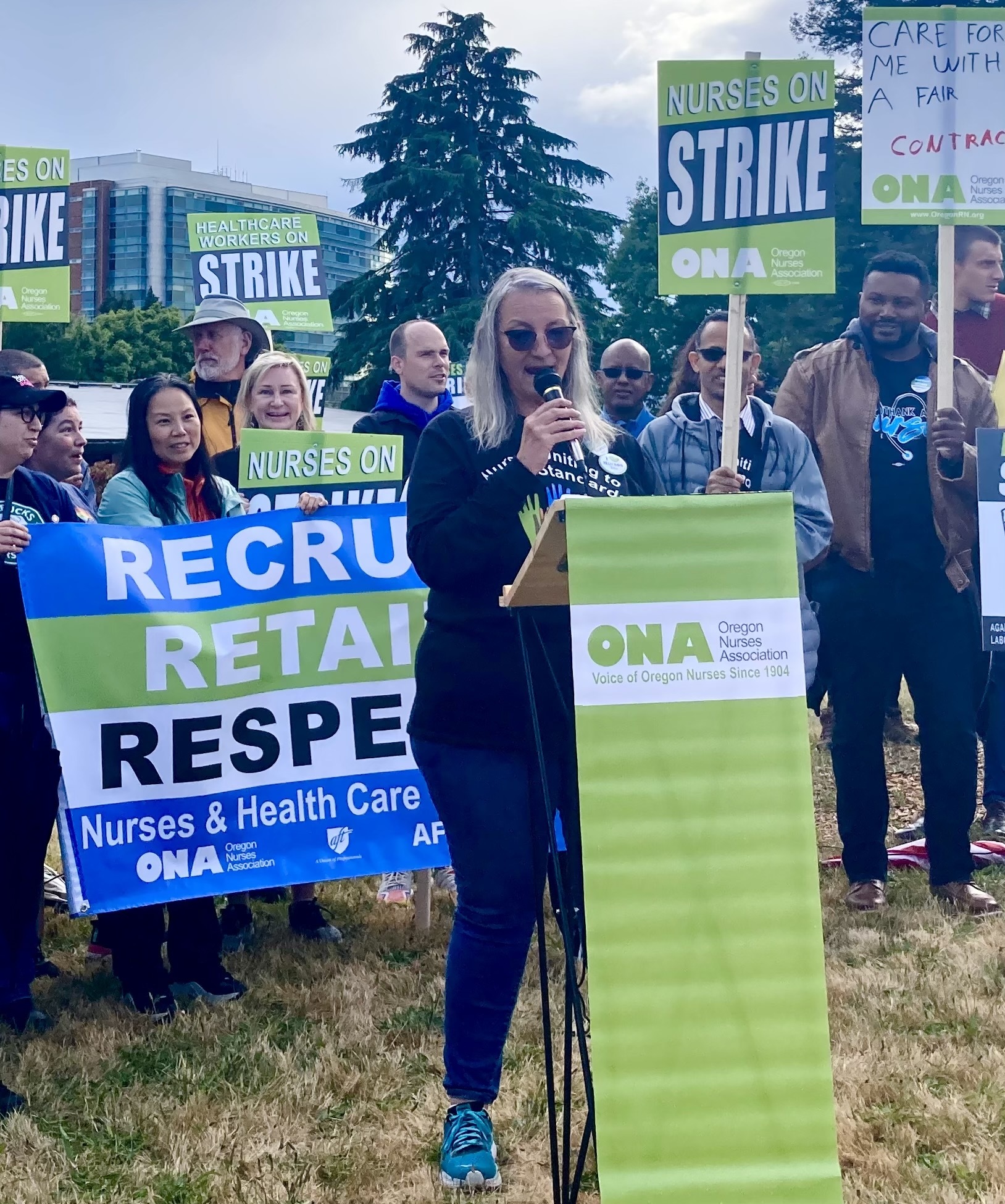 Standing with legislators and nurses behind ONA President Tamie Cline