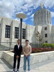 Student interns pose in front of the Capitol